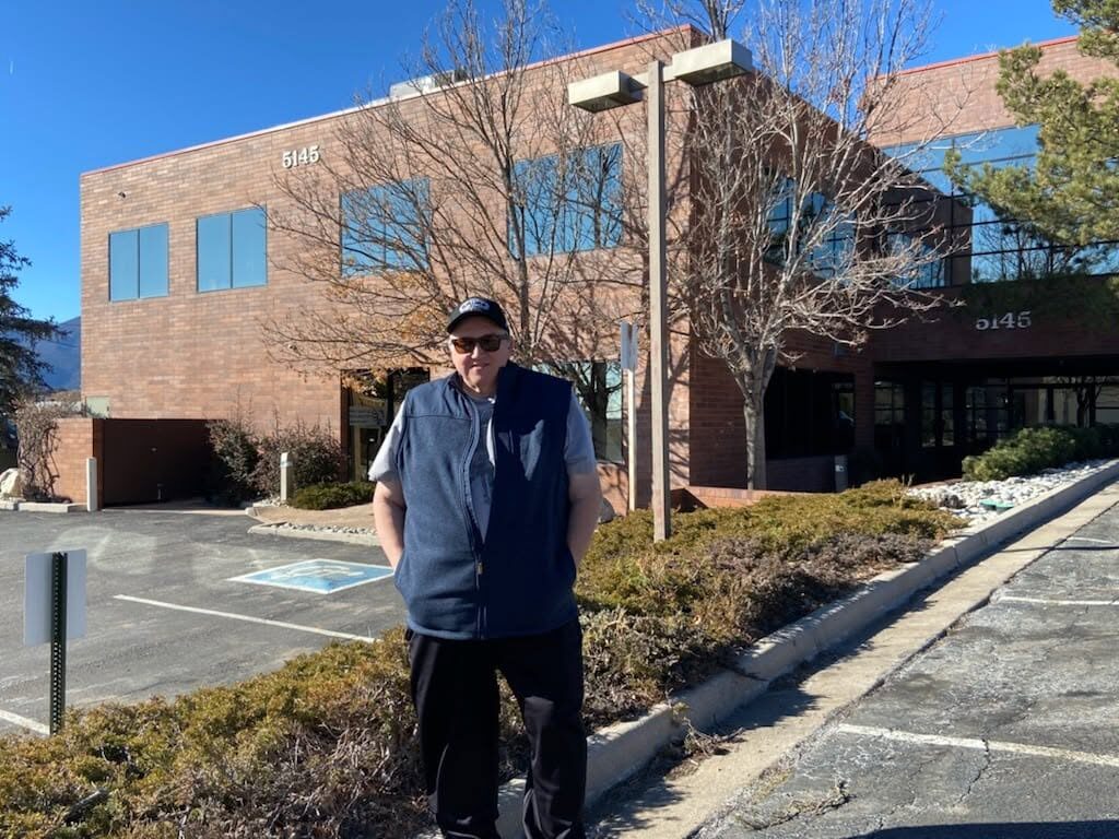 Uncle Steve in front of the Walton Stations building